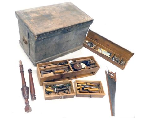 A large early 20thC pine tool chest, of rectangular form containing a large quantity of various tools, leather tape measure, 
