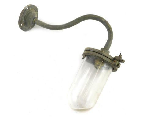 An exterior light fitting, with domed glass shade and S scroll arm with circular fitting and screw holders, 40cm wide.