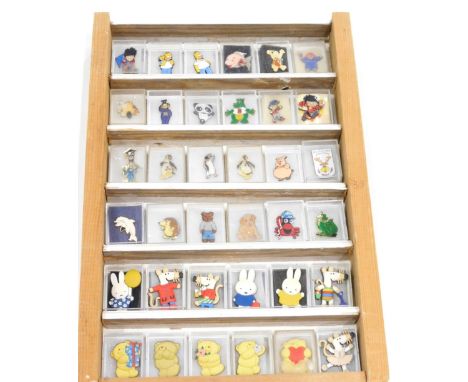 Various enamel and other badges, to include Homer Simpson 3cm high, penguin, etc. (1 case)