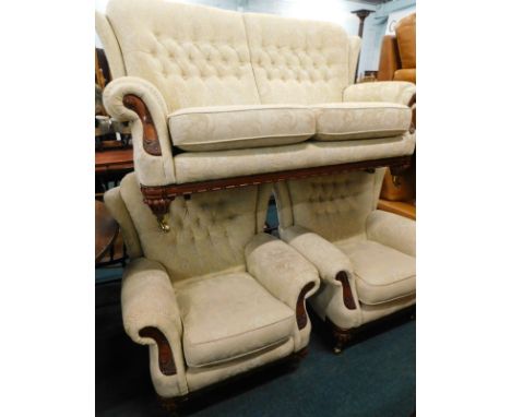 A walnut three piece suite, comprising two-seater sofa, and two armchairs, upholstered in gold pattern fabric with show frame