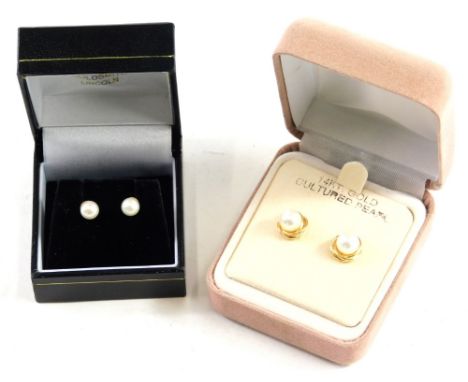 A pair of 14k backed pearl ear studs, and another pair of studs. (2 boxed)