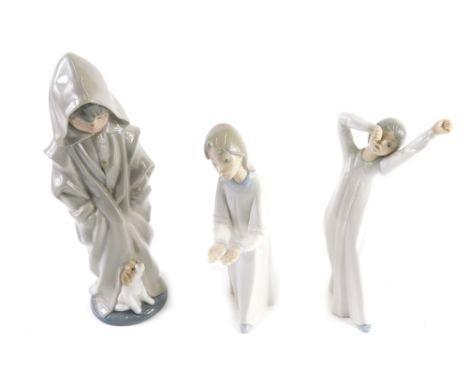 Various Lladro figures, comprising a Daisa figure of a girl A-28, 22cm high, Nao Girl Yawning and another of a Child in Hood 