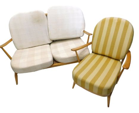 An Ercol two piece cottage suite, made in light beech with padded cushions. The upholstery in this lot does not comply with t