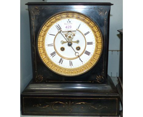 A 19th century black slate architectural mantel clock with visible escapement and French movement