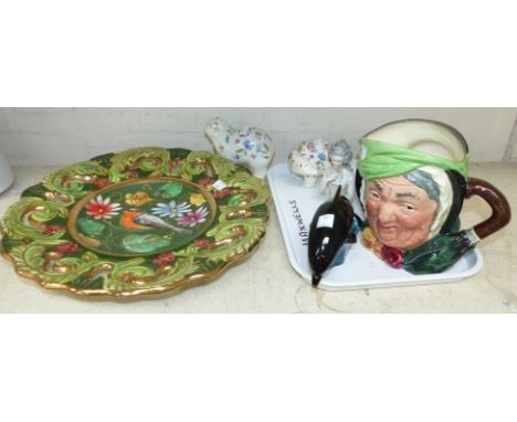 A Royal Doulton Toby jug of Dickensian woman, 2 Minton Hadden Hall china animals, Poole dolphin, a porcelain half doll, a con