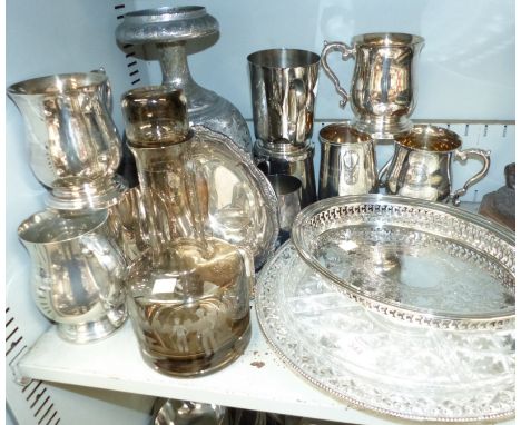 Nine silver plated mugs and other silver plate; a modern glass golf decanter; a bronzed golfer; etc.
