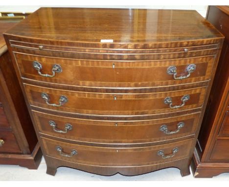 A reproduction inlaid mahogany 4 height chest of drawers with bow front