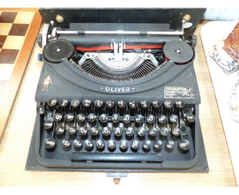 A 1930's "Oliver" portable typewriter; a framed facsimile photo:  England & Reading footballer Herbert Smith