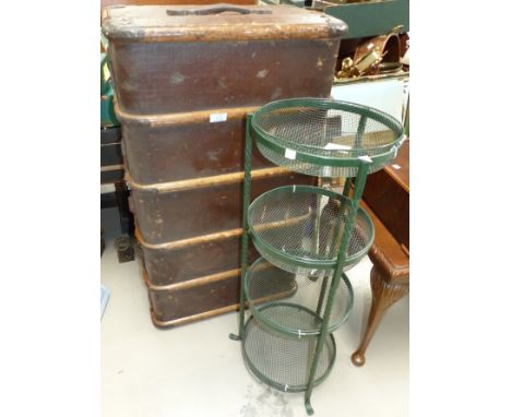 A woven fibre cabin trunk; a green metal 4 tier plant stand 