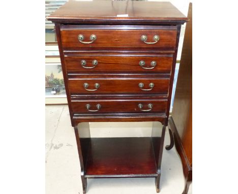 An Edwardian mahogany 4 drawer music cabinet with shelf under