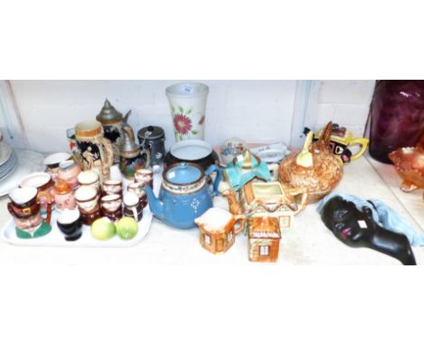 A 3 piece cottage tea set; novelty teapot; a collection of steins; novelty cruets; etc.