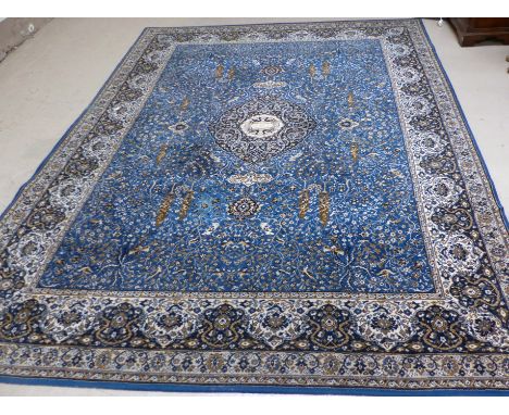 A Persian design machine woven blue ground carpet square