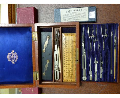 A mahogany cased set of drawing instruments including scale rule and proportional dividers; a boxwood triangular section rule