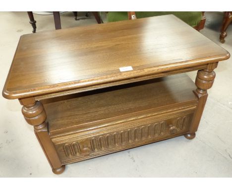 An Ercol TV stand with single drawer and drop back