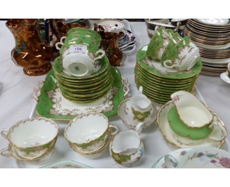 An early 20th century Coalport green, gilt and floral tea service, 40 pieces approx