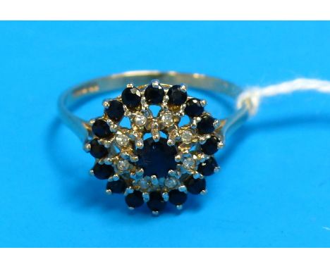 A 9 carat hallmarked gold dress ring set with diamond and sapphire coloured cluster