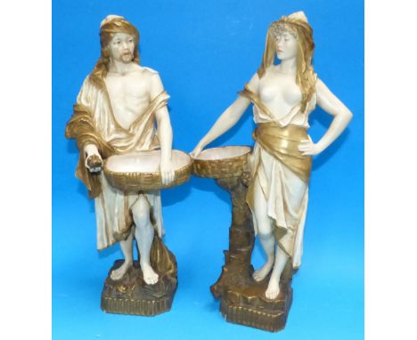 A pair of Ernst Wahliss Turn Wien ceramic figures in gilt and cream decoration in a classical style, ht 13" (chip to base of 
