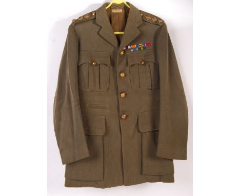 A WWI First World British Army uniform dress jacket, named to the label to a ' Lieut. G. S. Sale '. Bearing the original meda