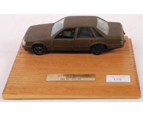 A vintage BRIXMIS Cold War related presentation 1/24 scale diecast model car (believed to be by Polistil). The model mounted 