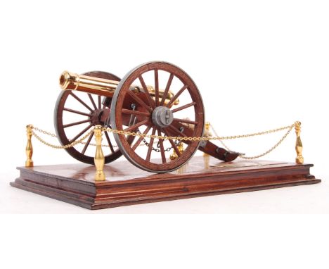 A reproduction scale desktop Civil War Model 1857 field cannon having a fruit wood base &amp; wheels with lead furnishing and