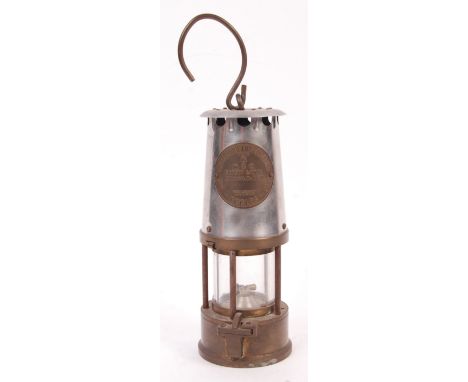 A mid 20th century brass Eccles miners lamp embossed 'Protector Lamp &amp; Lighting type 6 M &amp; Q Safety Lamps', with hand