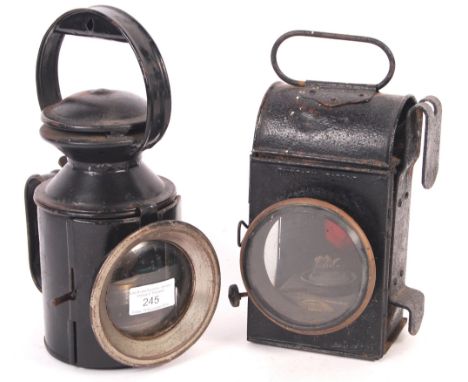 Two original vintage early 290th century antique railway carriage / station lamps comprising an ebonised LNER example and a D