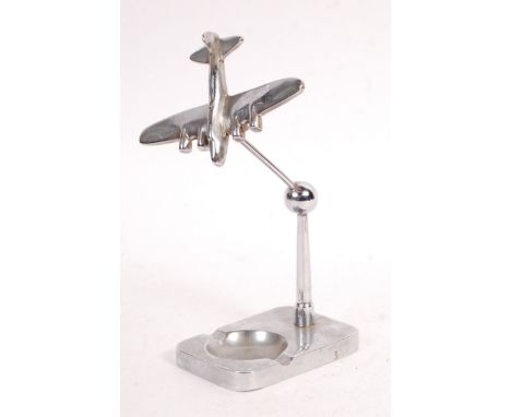 An original vintage mid-century Art Deco style chrome WWII Second World War related ashtray. Fitted with a four-engined Bombe