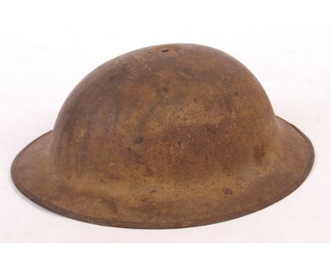 An original WWI First World War British Army ' Tommy ' steel brodie helmet. c1917. Complete with liner, and partial original 