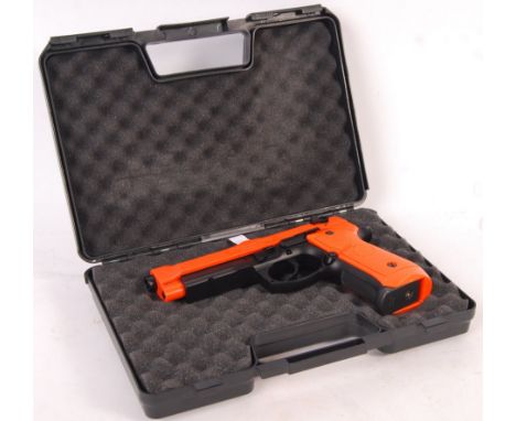 A contemporary 2003 Air Model Firearms M190 Special Forces 6mm handgun. Orange and black plastic construction with some metal