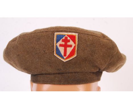 A rare original WWII Second World War ' Free French Commando ' GS ( General Service ) uniform beret, with cloth badge. Named 