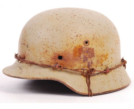 A rare original WWII Second World War German Third Reich Nazi Army ' Afrika Korps ' M35 steel combat infantry helmet, in orig