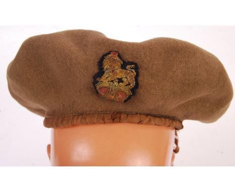 A scarce original WWII Second World War British Army Major's badged beret. Dated 1944, with twin vents. War Department stampe