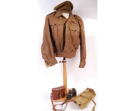 A collection of assorted 1940's British Army military uniform items and related effects. Comprising of a West Yorkshire Regim