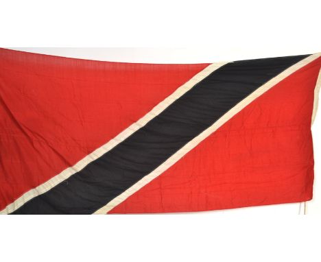 A vintage large 20th Century flag of Trinidad &amp; Tobago having the red ground with white diagonal stripe and black stripe 