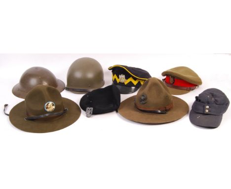 A good collection of assorted WWII Second World War and post-War military uniform headwear / helmets / caps. Including; a pos