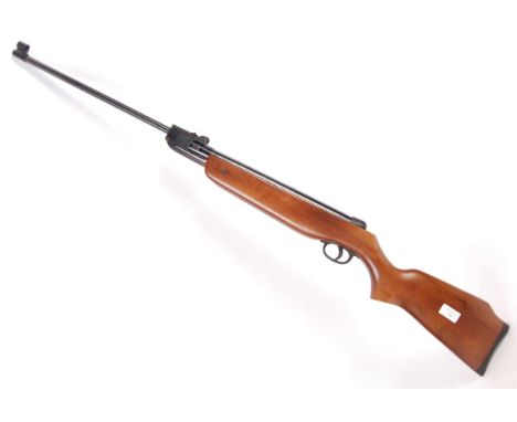A vintage Edgar Brothers made .177 calibre break-barrel air rifle. Wooden stock, with adjustable sight to barrel. Stamped ' E