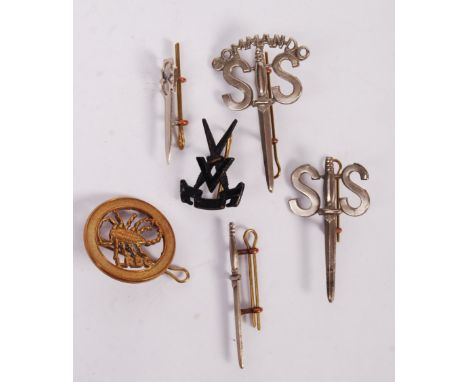 A good collection of believed original WWII Second World War and post-war British Army Commando cap badges. Includes badges f