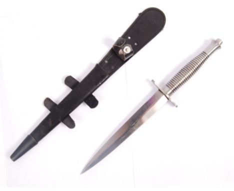 A WWII Second World War replica Fairbairn Sykes 2nd pattern F-S all steel fighting knife and scabbard, having the bevelled po