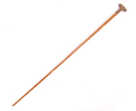 A vintage 20th Century Chinese brass topped swagger stick having a ' T ' shaped handle / grip with Chinese scroll forms and t