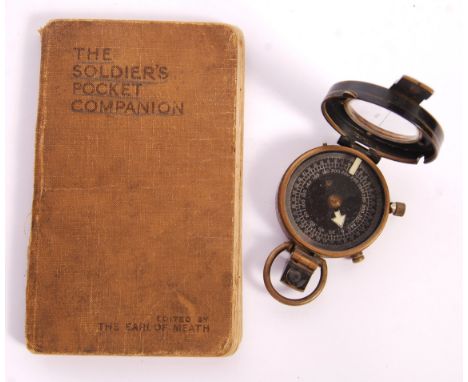 An original WWI First World War brass Mk VII marching compass - the top stamped for 1918 with broad arrow. Appears in working