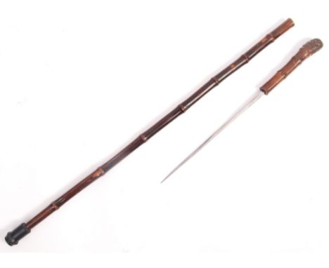 A 20th century cane walking stick having a concealed square pointed stiletto blade and rubber foot. Measures; 90cm.&nbsp;