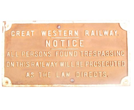 An original vintage early 20th century Great Western Railway cast iron notice sign reading 'All Persons Found Trespassing On 