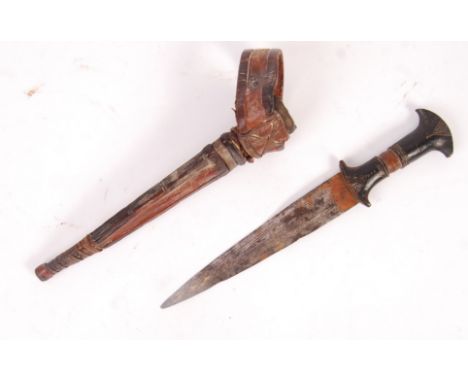 An early 20th century African Sudanese Mahdi Dervish Arm Dagger with carved and shaped wooden hilt, double edged triangular b