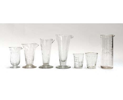 A quantity of antique and vintage measuring glasses, the tallest 15cmH, to include three Victorian etched conical measuring g