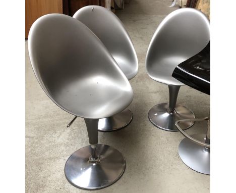 A set of three Magis Bombo style silver swivel chairs