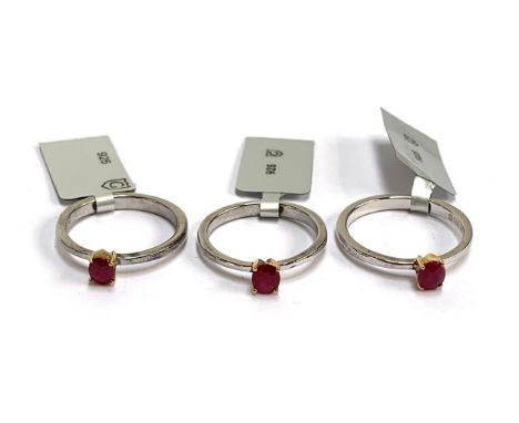 Three sterling silver ruby solitaire rings with 14ct gold prongs, the Burmese rubies 0.4cts, size P, 6.7g