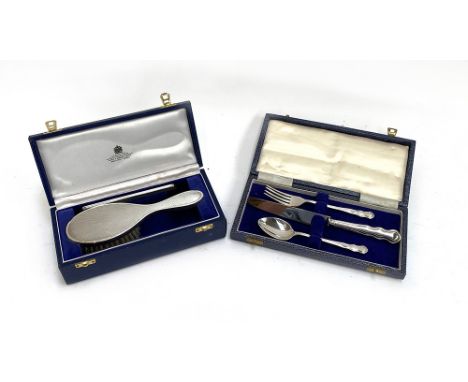 A cased engine turned silver hairbrush and comb, London 1982, in Asprey box; together with a cased silver christening set, co