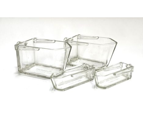 A pair of Orrefors wedge shaped jugs, 11cmH; together with two small Orrefors sauce boats