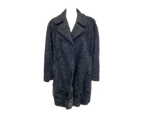 A vintage 'Mister Monty Furs, Altrincham', black astrakhan coat with suede panel detail, 44" chest
