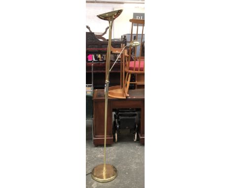 A gilt metal floor standing lamp with reading lamp